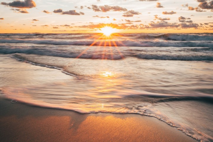 a sunset over a beach