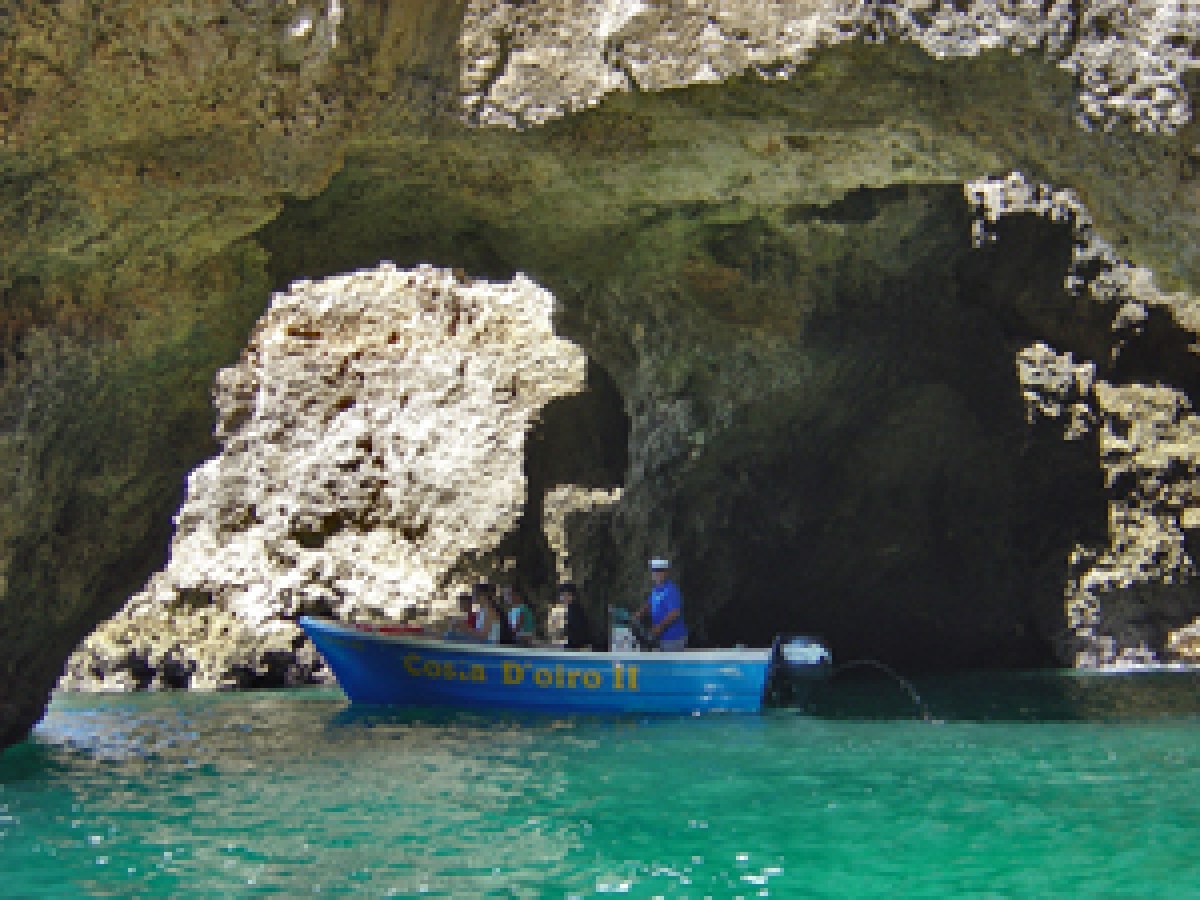 a person sitting on a rock in a pool of water