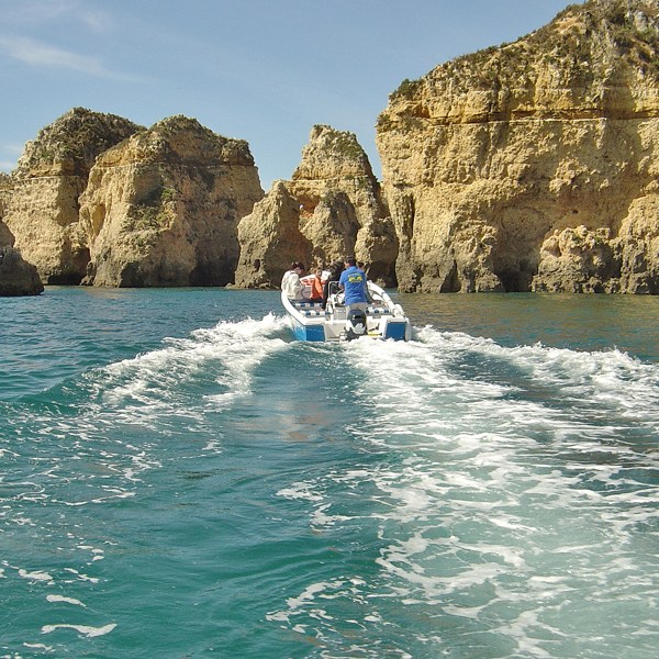 a body of water with a mountain in the background
