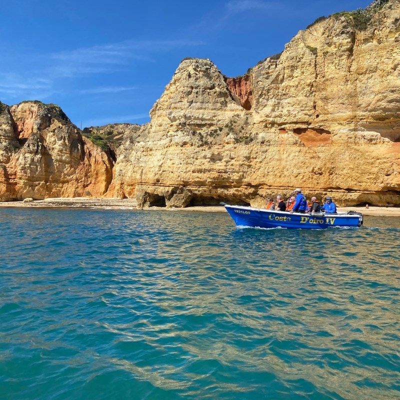 a body of water with a mountain in the background