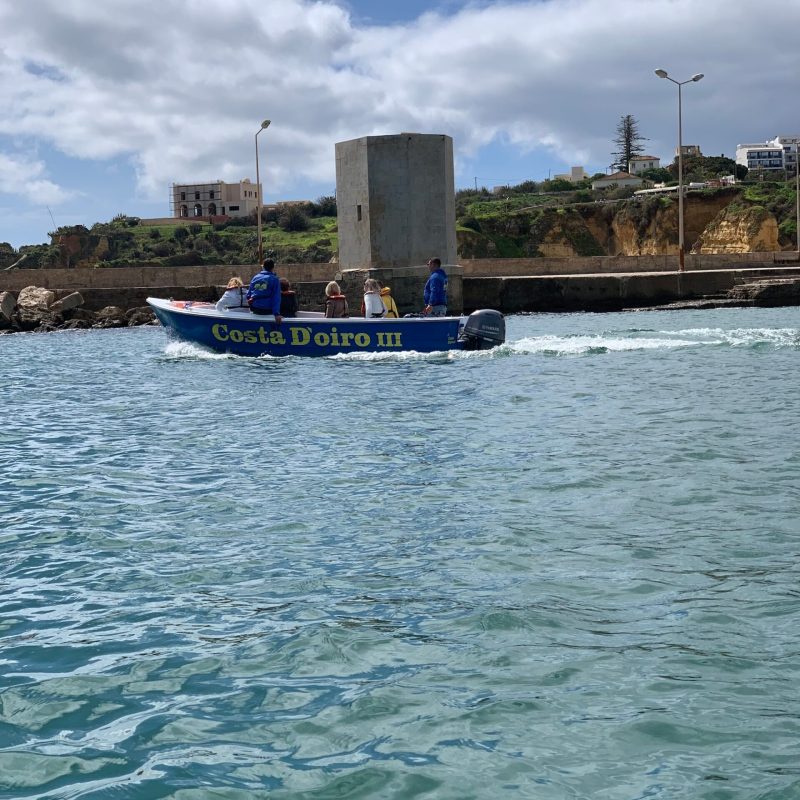 a small boat in a large body of water