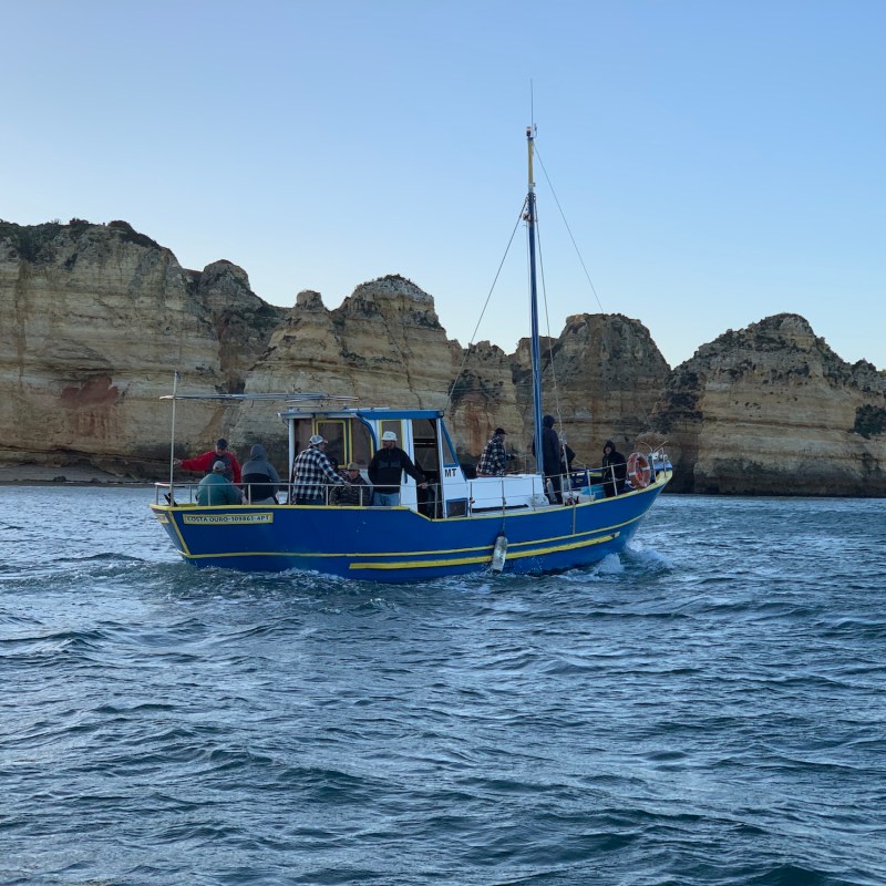 a small boat in a large body of water
